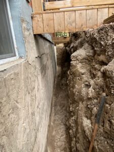 Basement Exterior Fully Excavated Ready for Exterior Waterproofing